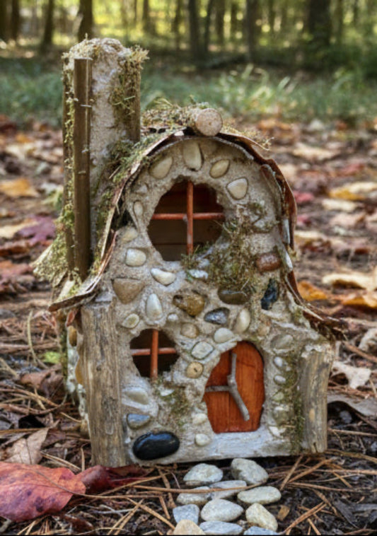 Decorative fairy house made of stones and wood 